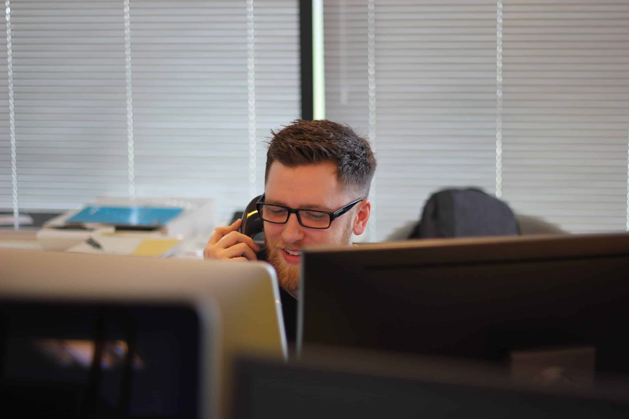 person on the phone in an office setting